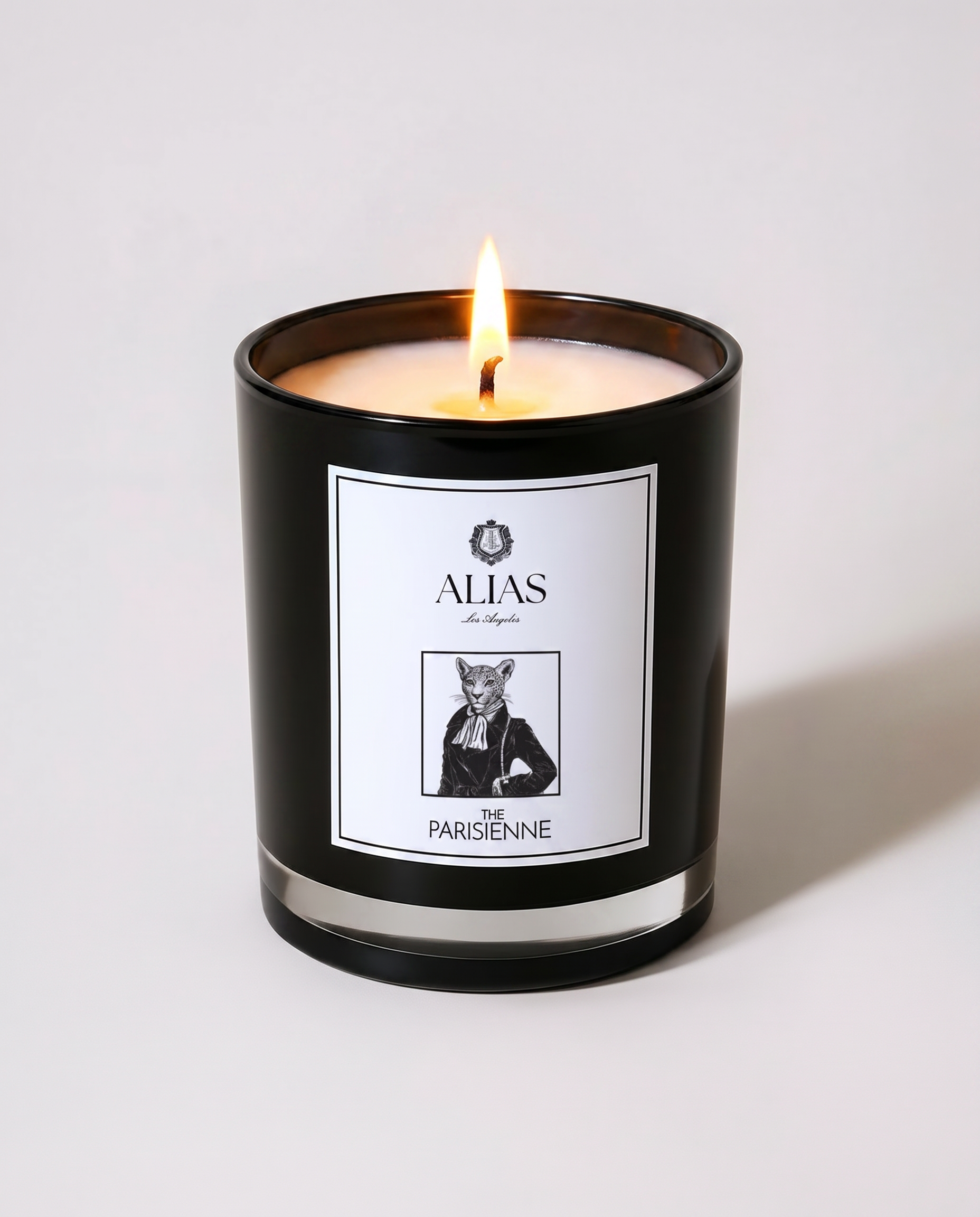 Alias Los Angeles The Parisienne candle – glossy black jar featuring an elegant blend of modern rose, black currant, and soft musk; a romantic soy wax candle inspired by Parisian elegance, perfect for feminine spaces, gifting, or elevated everyday ambiance.