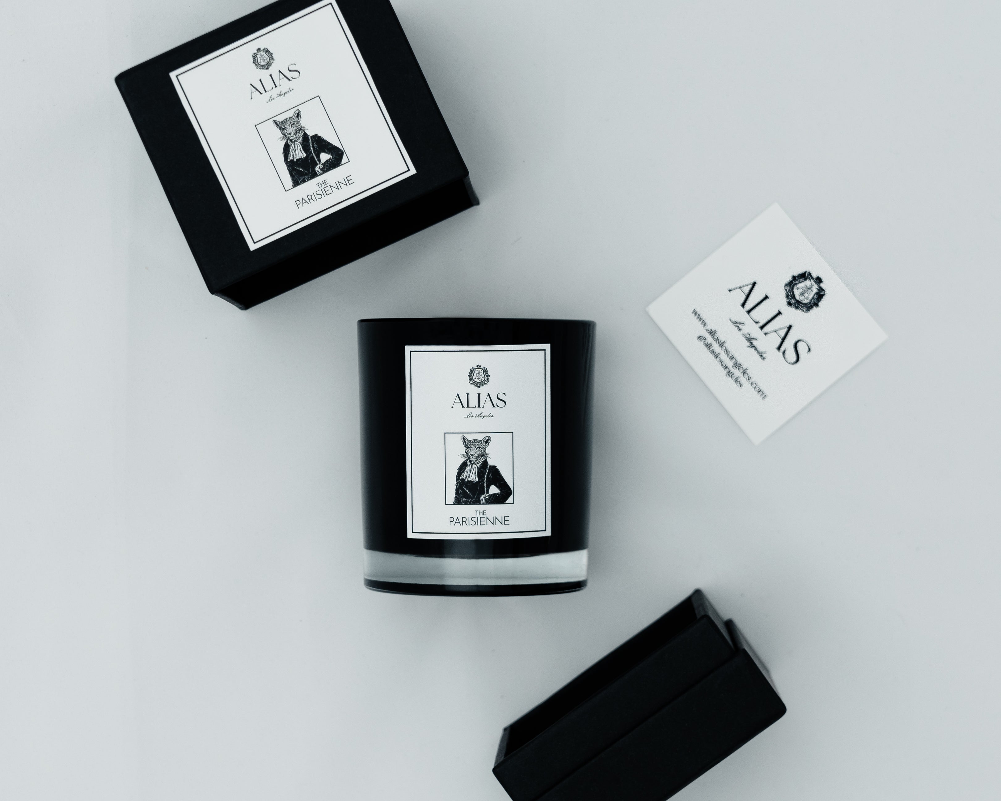 Luxury rose and black currant Parisienne candle by Alias Los Angeles in a chic glass jar