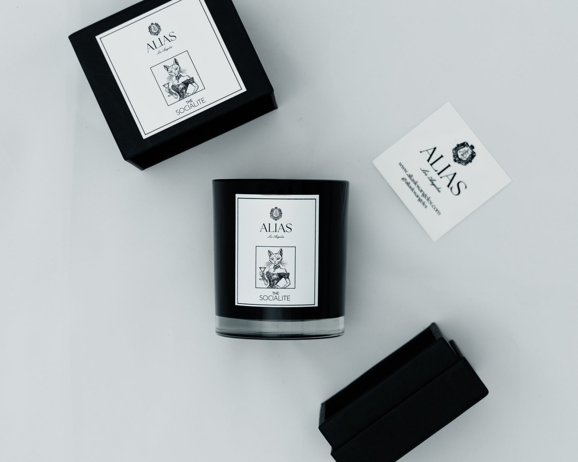 Shop The Socialite luxury scented candle by Alias Los Angeles — hand-poured with notes of jasmine, amber, and saffron for a rich, elegant home fragrance.