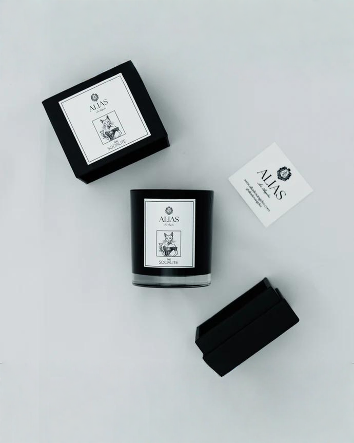 Shop The Socialite luxury scented candle by Alias Los Angeles — hand-poured with notes of jasmine, amber, and saffron for a rich, elegant home fragrance.