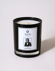 The Casanova candle by Alias Los Angeles – glossy black jar featuring a warm, seductive blend of vanilla, patchouli, and pear; a luxurious soy wax candle perfect for romantic settings, moody interiors, or upscale gifting.