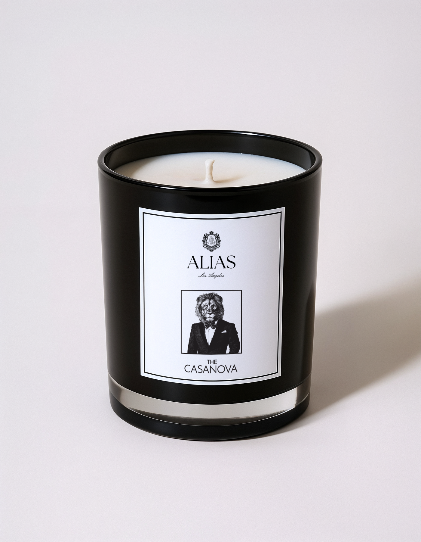 The Casanova candle by Alias Los Angeles – glossy black jar featuring a warm, seductive blend of vanilla, patchouli, and pear; a luxurious soy wax candle perfect for romantic settings, moody interiors, or upscale gifting.