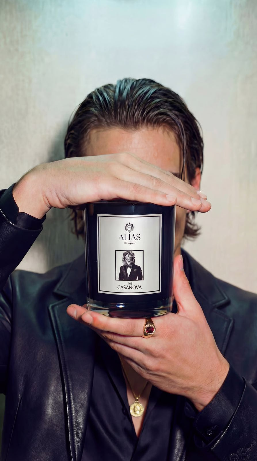 The Casanova luxury scented candle by Alias Los Angeles – glossy black jar filled with a seductive blend of vanilla, patchouli, and pear; perfect for romantic nights, gifting, or elevated home décor.