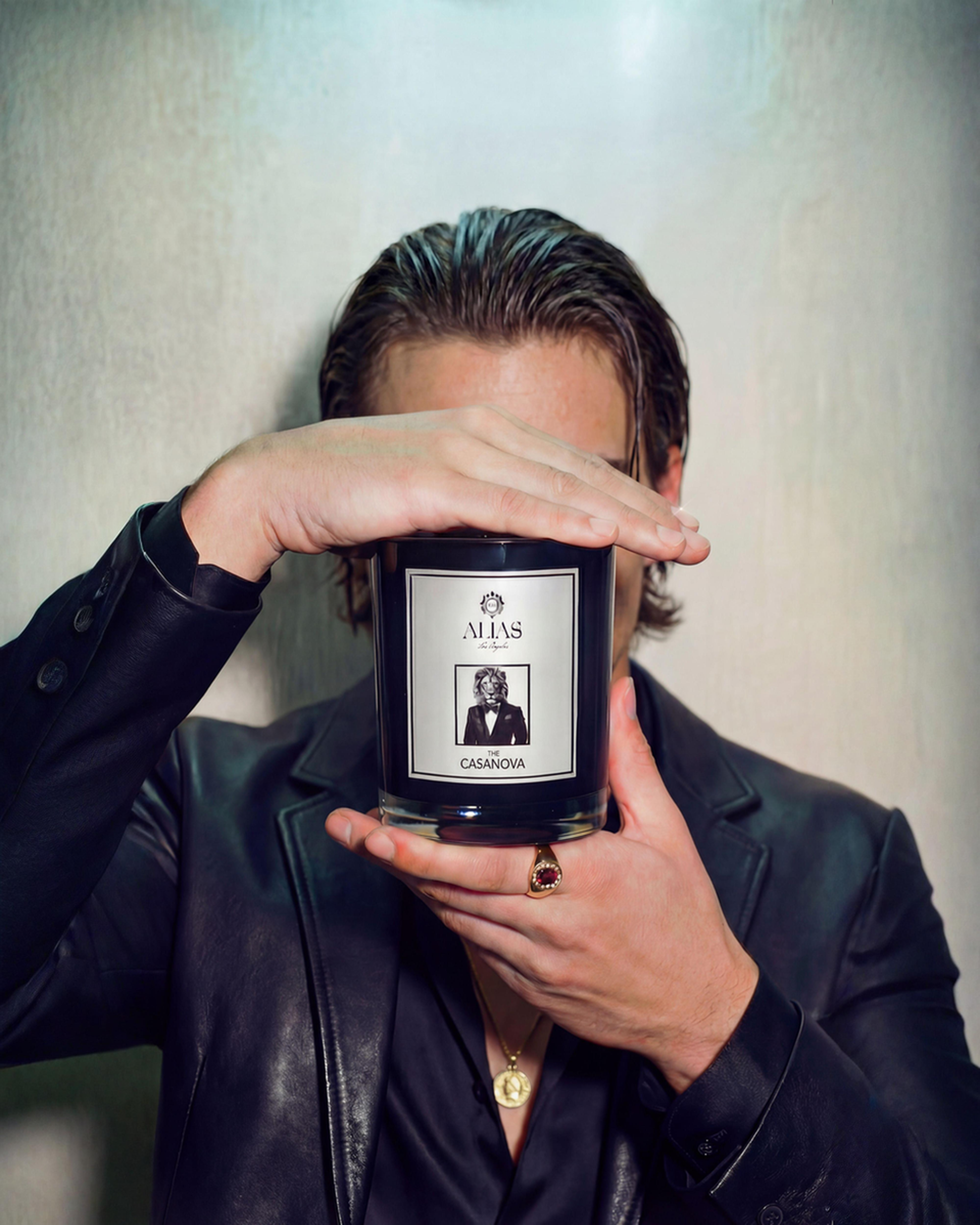 The Casanova luxury scented candle by Alias Los Angeles – glossy black jar filled with a seductive blend of vanilla, patchouli, and pear; perfect for romantic nights, gifting, or elevated home décor.