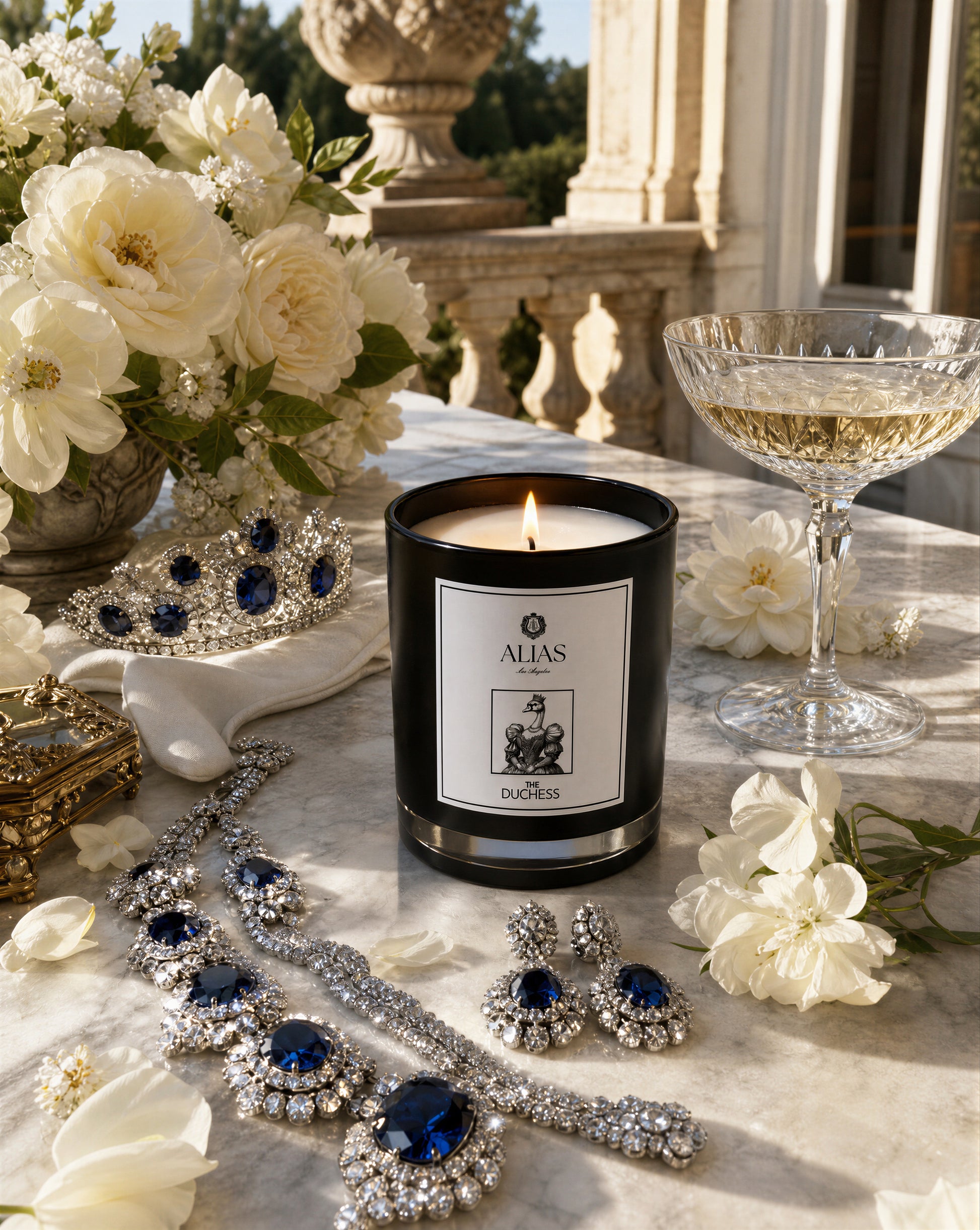 The Duchess candle by Alias Los Angeles displayed in an elegant, refined setting with luxurious styling that evokes timeless sophistication. The candle is featured prominently in the foreground, surrounded by classic décor and soft lighting that highlights its premium design.