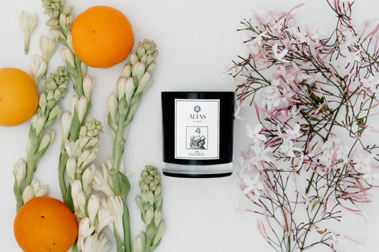 The Duchess candle by Alias Los Angeles styled in a setting of timeless elegance—surrounded by vintage décor, delicate florals, and a soft, romantic glow. With notes of Tuberose, Jasmine, and Orange Blossom, it evokes the grace and poise of modern royalty, leaving an impression of refined beauty with every flicker.
Change your scent, change the story—Alias Los Angeles ™, where scent is your signature.