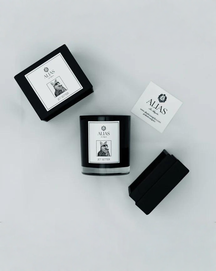 Luxury Jet Setter candle by Alias Los Angeles featuring citrus bergamot smoky black tea and warm cedarwood for a sophisticated travel inspired home fragrance