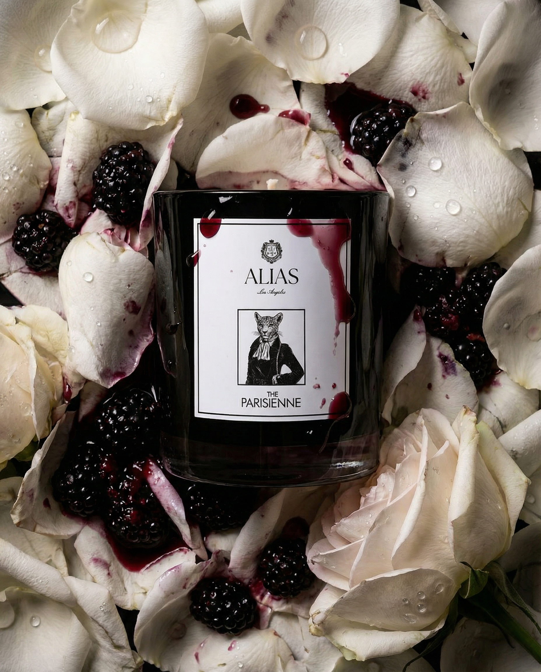The Parisienne luxury candle by Alias Los Angeles with rose and black currant berry fragrance inspired by Paris Tuileries Gardens in elegant packaging