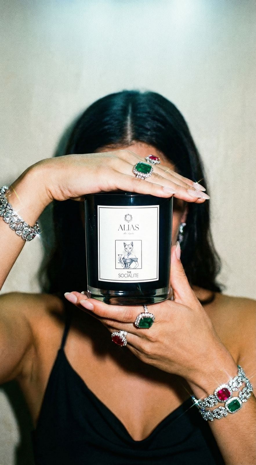 The Socialite luxury candle by Alias Los Angeles – glossy black jar featuring an opulent blend of jasmine, saffron, and amber; a glamorous soy wax candle perfect for entertaining, gifting, or elevating any modern space.