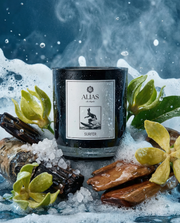 The Surfer luxury candle by Alias Los Angeles featuring ylang ylang sea spray birchwood and koa wood inspired by ocean breeze and coastal serenity