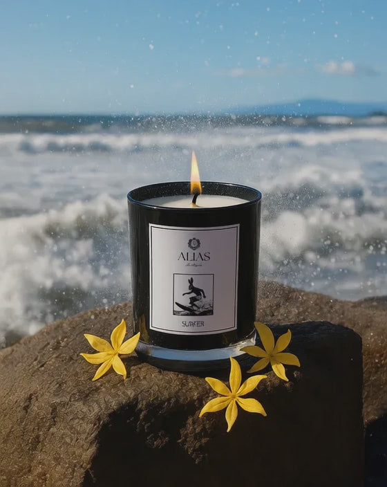 Load video: Candle with a label on a rock by the ocean